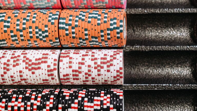 Rows of casino chips representing offer terms to compare
