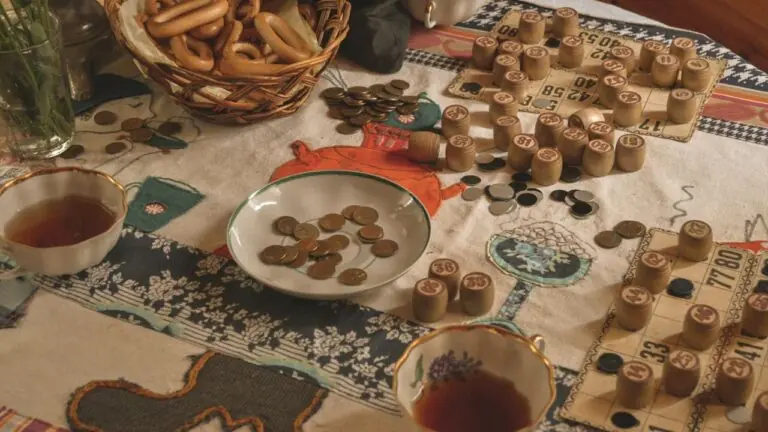 Bingo cards and wooden number pieces on a table